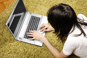 Image showing Young woman with laptop 