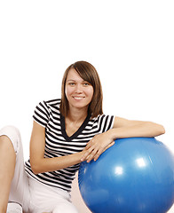 Image showing Young woman with gym ball