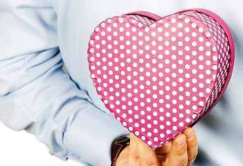 Image showing Businessman hiding a gift