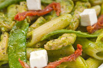 Image showing Italian penne pasta with sundried tomato and basil