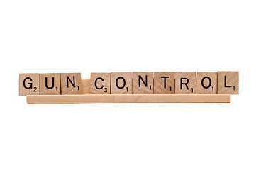 Image showing Gun Control scrabble word isolated on white.