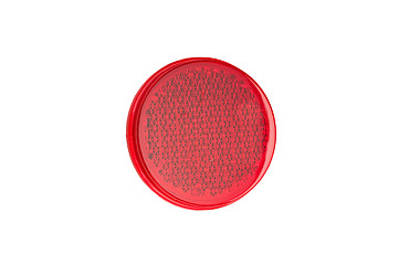 Image showing Round red reflector isolated on white.