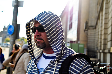 Image showing Middle age traveling man wearing hood