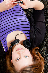 Image showing happy teenager girl listening to music