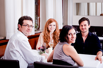 Image showing smiling happy people in restaurant