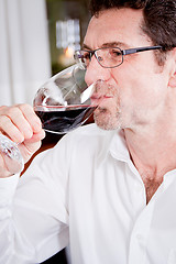 Image showing couple drinking red wine in restaurant