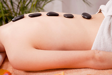 Image showing young attractive woman get hot stone massage 