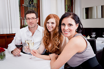 Image showing smiling happy people in restaurant