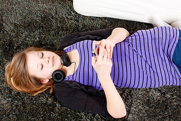 Image showing happy teenager girl listening to music