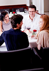 Image showing smiling happy people in restaurant