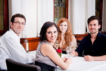 Image showing smiling happy people in restaurant