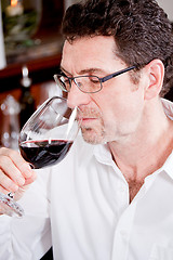 Image showing couple drinking red wine in restaurant