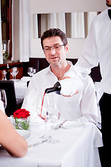 Image showing couple drinking red wine in restaurant