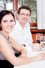 Image showing smiling happy people in restaurant