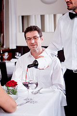 Image showing couple drinking red wine in restaurant