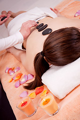 Image showing young attractive woman get hot stone massage 