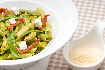 Image showing Italian penne pasta with sundried tomato and basil