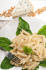 Image showing Italian pasta penne gorgonzola and pine nuts