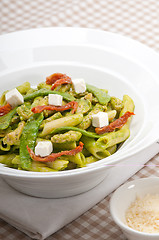 Image showing Italian penne pasta with sundried tomato and basil