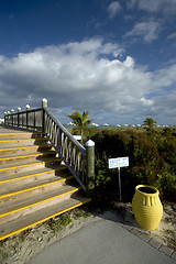 Image showing boardwalk with yellow urn