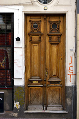 Image showing brown wood old door and a grate