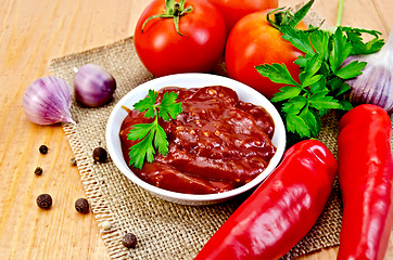 Image showing Ketchup with vegetables on a napkin burlap