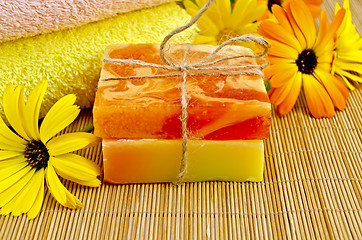 Image showing Soap homemade orange and yellow with marigold