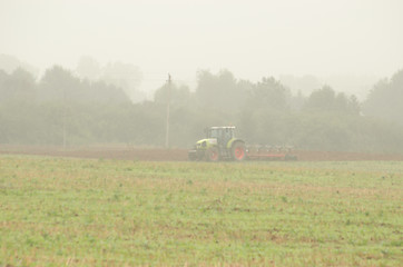 Image showing morning agriculture works tractor plow field fog 