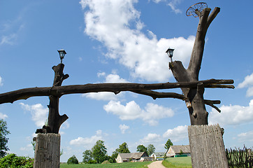 Image showing wooden park gate tree trunk rural homestead house 