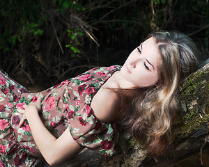Image showing Beautiful girl in the national dress in the forest