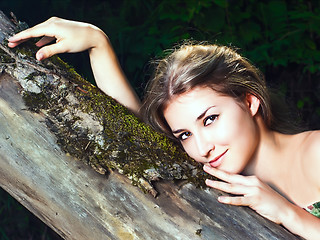 Image showing Beautiful girl in the national dress in the forest