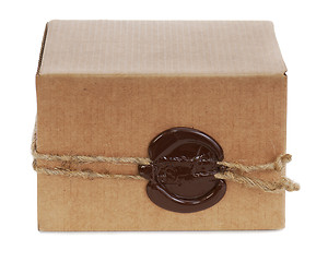 Image showing brown cardboard box with stamp isolated on white background