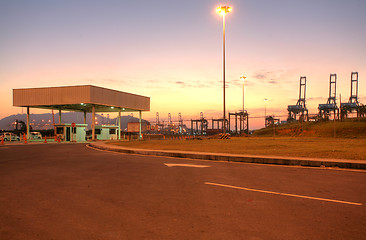 Image showing freight ship with working crane at dusk for Logistic Import Expo