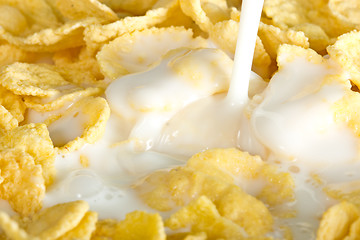 Image showing milk pouring on a cornflakes