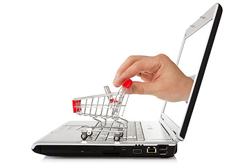 Image showing laptop and hand with shopping cart