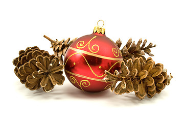 Image showing red christmas bauble and pine cones