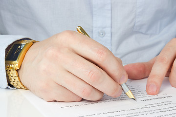 Image showing businessman signing agreement