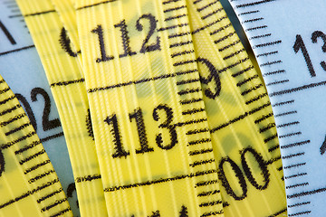 Image showing yellow and blue measuring tape 