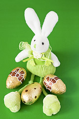 Image showing easter bunny and three golden eggs