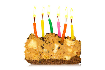 Image showing Piece of cake with burning candles