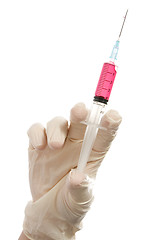 Image showing Hand holding syringe