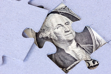 Image showing Jigsaw puzzle with one dollar