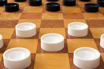 Image showing checker board with plastic checkers
