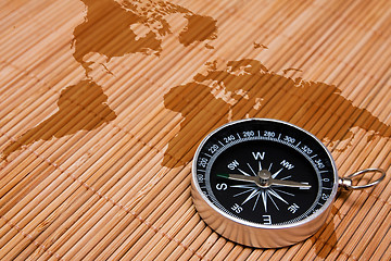 Image showing black compass on the abstract world map