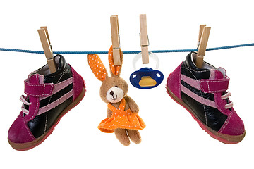 Image showing baby goods hanging on a cord
