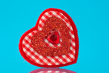 Image showing red  heart on blue background