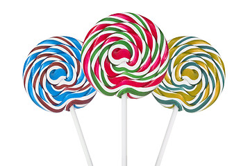 Image showing Three colorful spiral lollipops