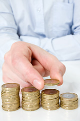 Image showing  hand putting coin to money staircase