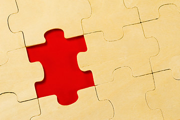 Image showing wooden puzzle  with one piece missing