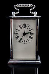 Image showing old clock on black background 